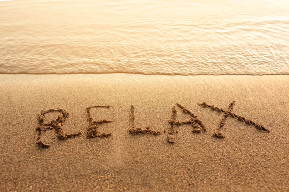 relax written in sand Retreats Holistic Centre
